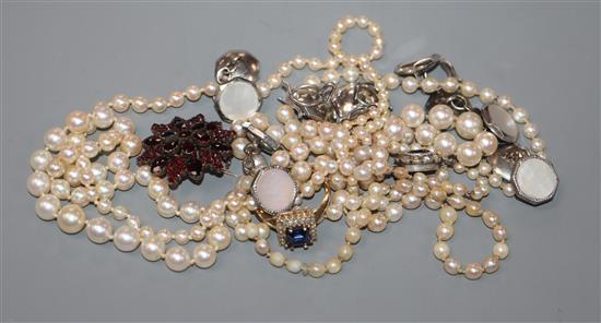 Three assorted cultured pearl necklaces, a Victorian yellow metal and garnet brooch, a 9ct ring and assorted white metal studs etc.